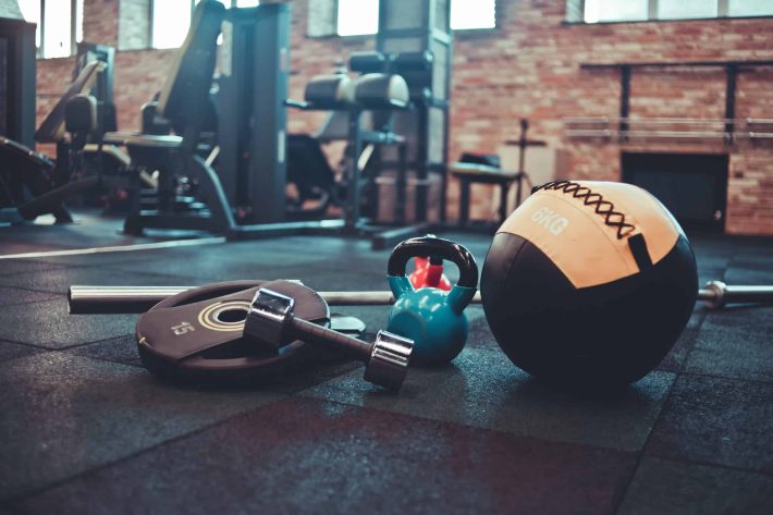 disassembled-barbell-medicine-ball-kettlebell-dumbbell-lying-floor-gym-sports-equipment-workout-with-free-weight-functional-training-scaled